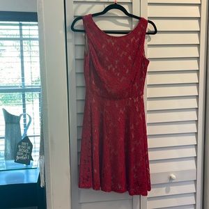 Red lace dress ,gold zipper in the back size 3 very pretty, and soft sleeveless